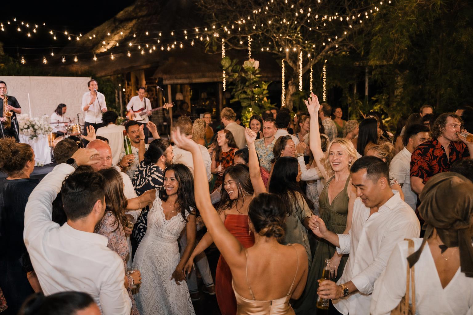 Guests celebrating at a full Bali wedding reception