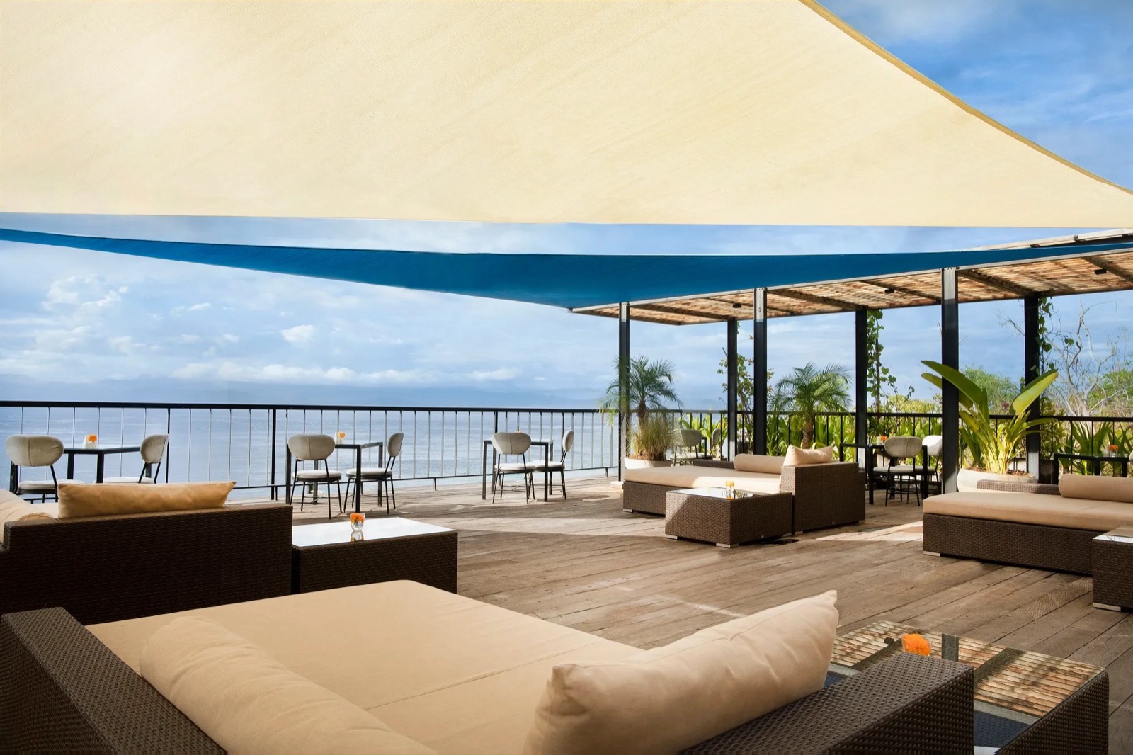 Ocean-view lounge deck under shade sails at Adiwana Warnakali on Nusa Penida, Bali