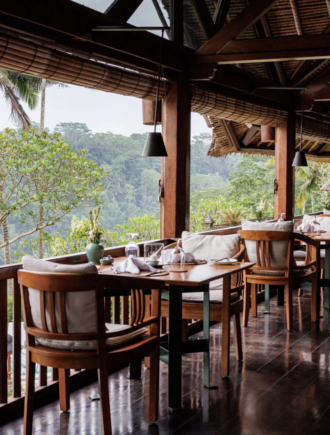 Dining pavilion overlooking Ayung valley with wooden furniture and natural light, Amandari, Ubud