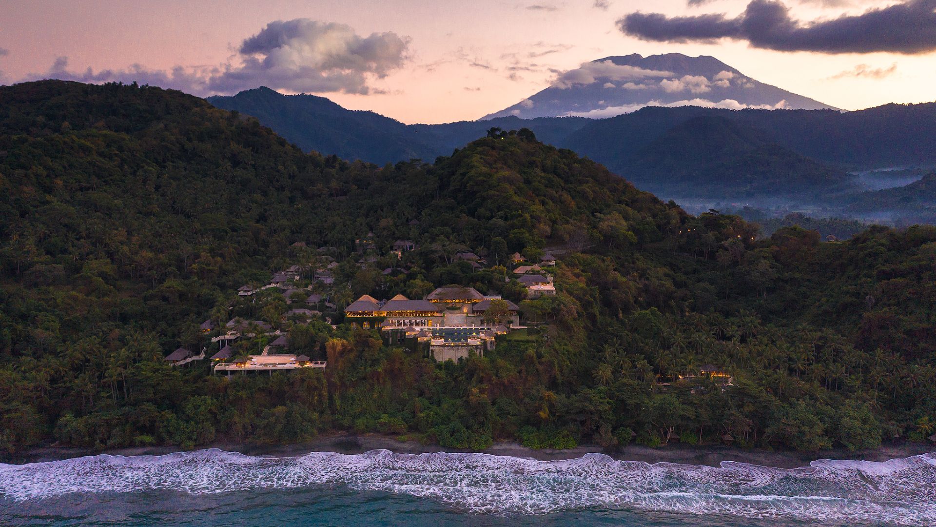 View of Amankila terraced into the hillside above the sea in Manggis, east Bali