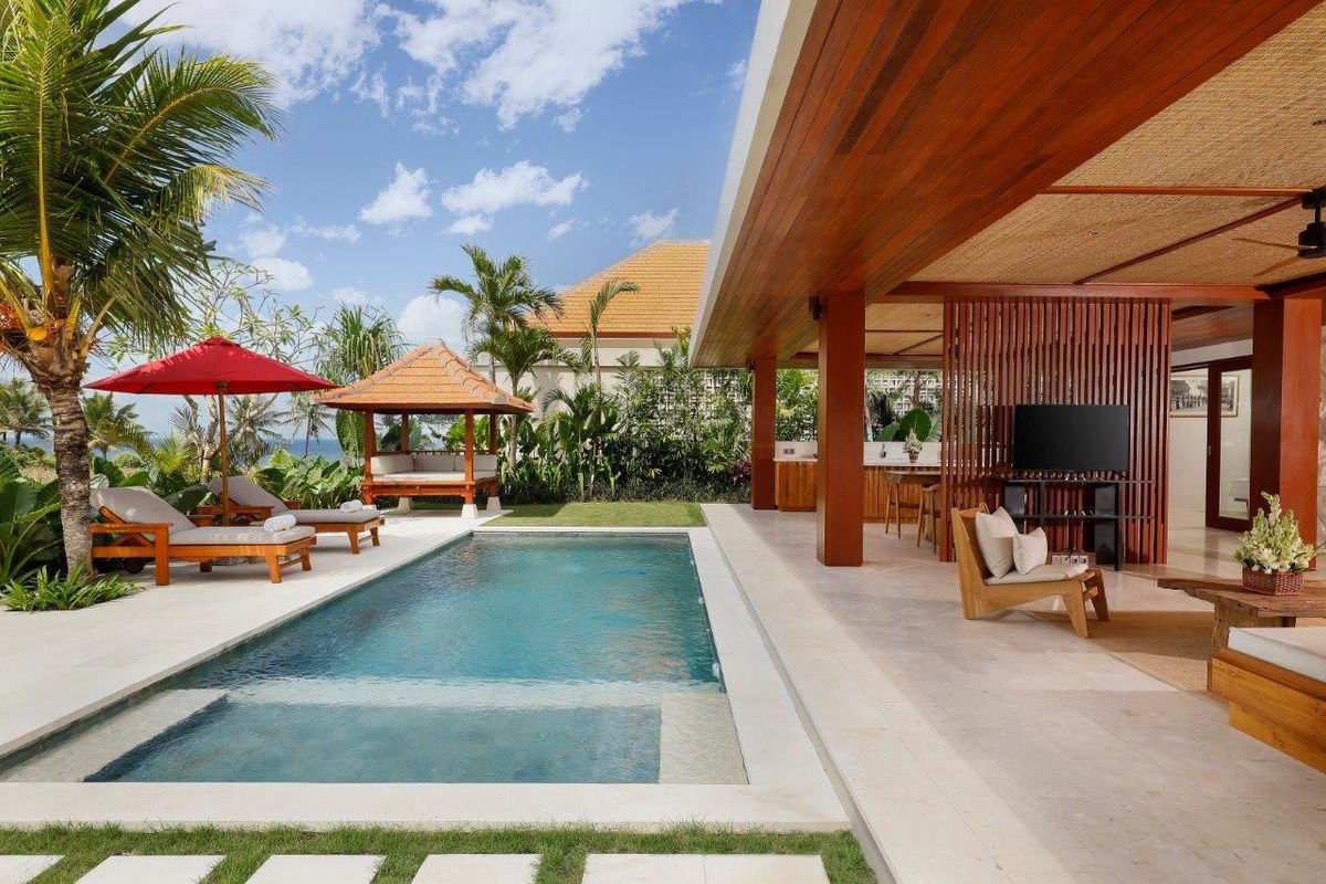 Garden and ceremony space at Amarta Beach Retreat looking toward the black-sand shore