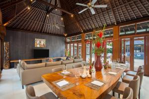 Villa living and dining area with garden access at Amarterra Villas Bali