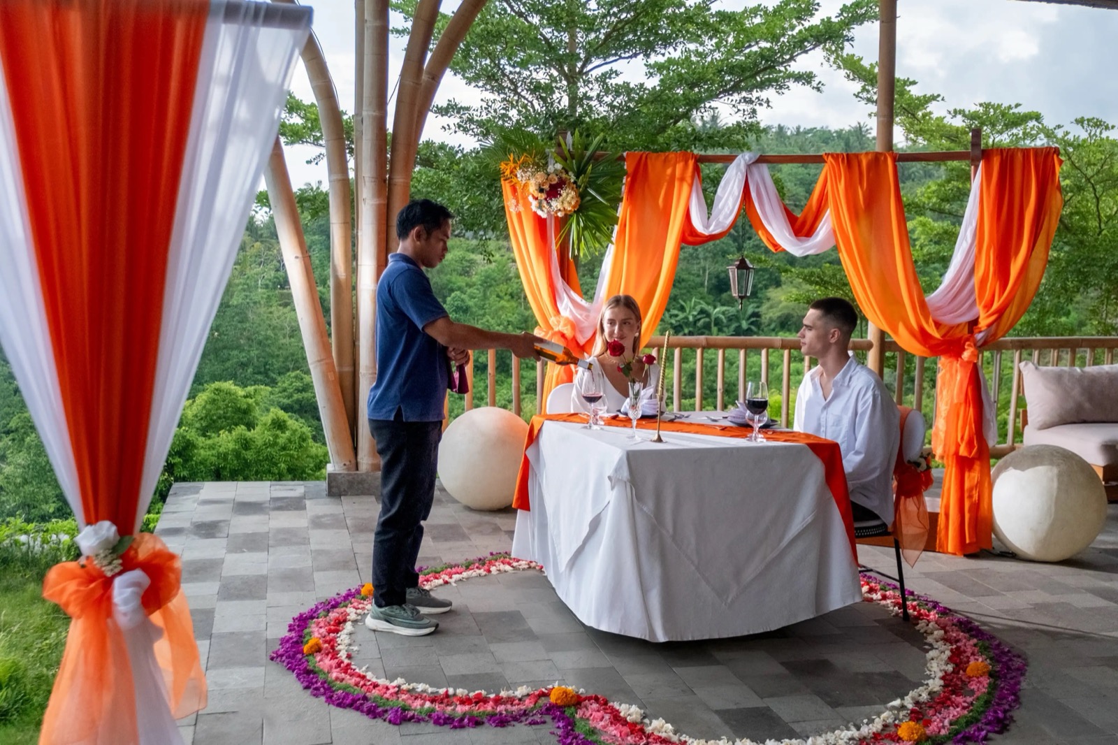 Draped pavilion set for a private celebration dinner at Amok Sunset on Nusa Penida, Bali