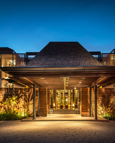 Resort building exterior at dusk with architectural lighting at The Anvaya Beach Resort Bali