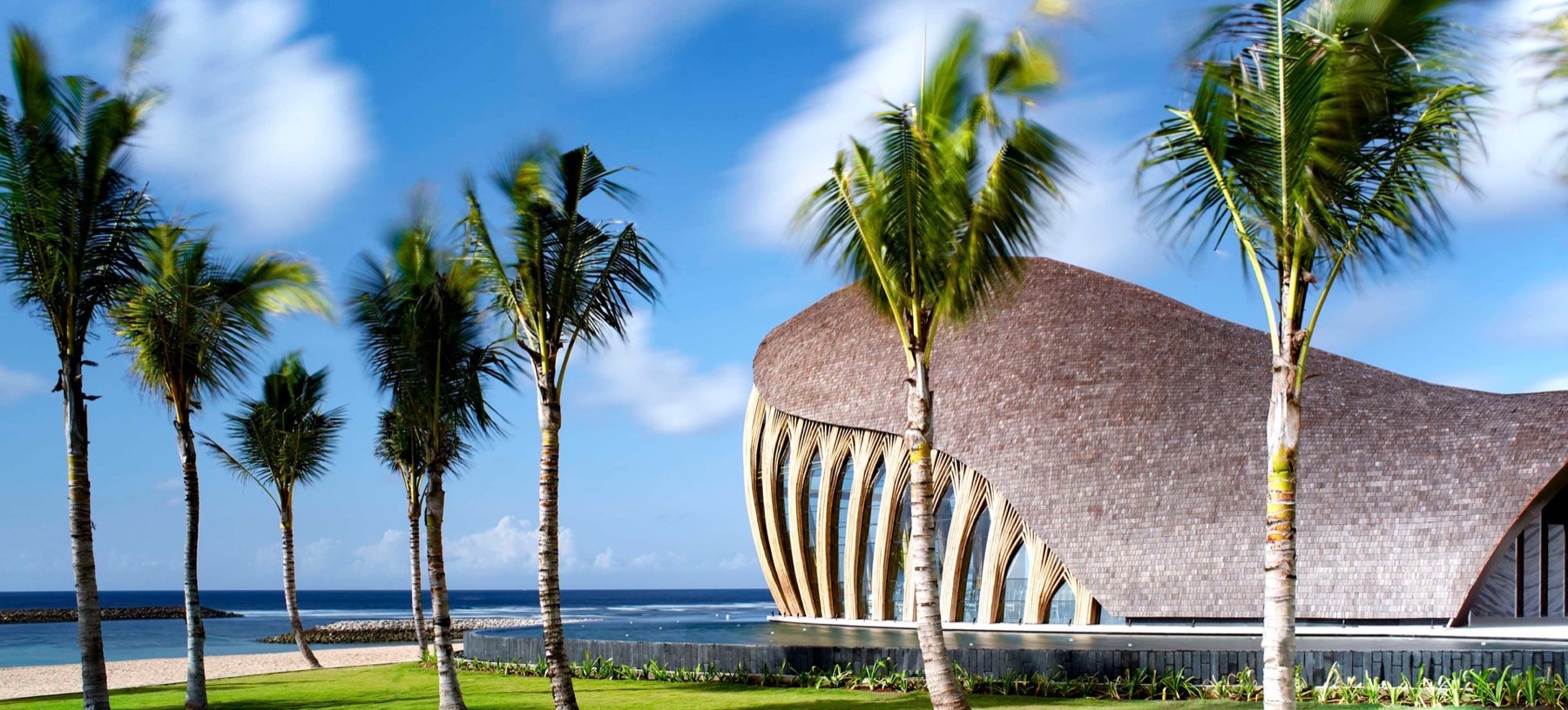Exterior of the shell-shaped bamboo Apurva Chapel beside the beach at The Apurva Kempinski Bali, Nusa Dua