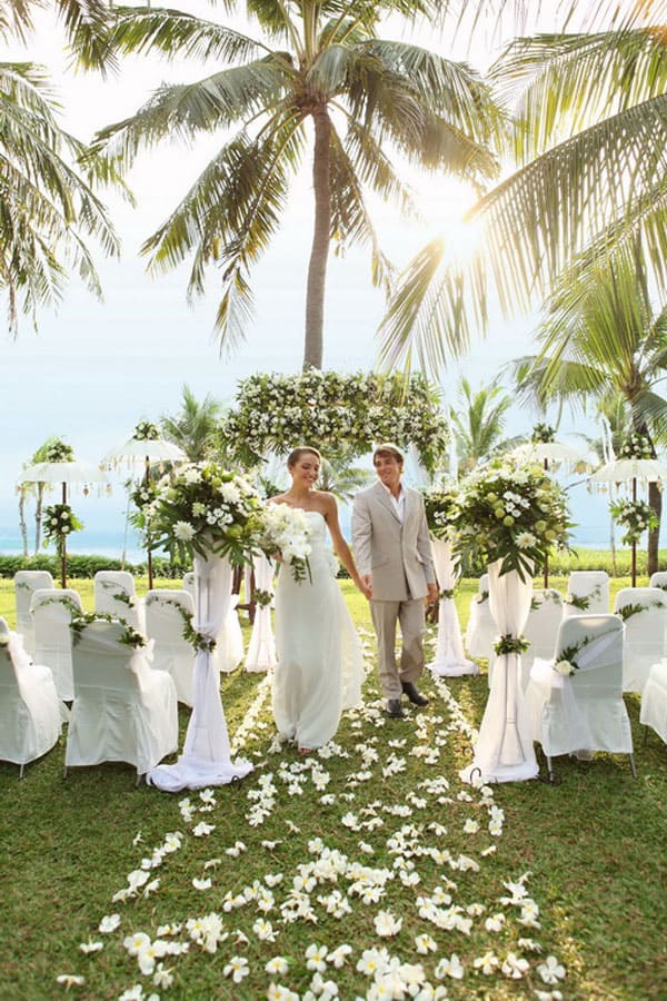 Beachfront wedding setup in the garden at Bali Mandira Beach Resort, Legian