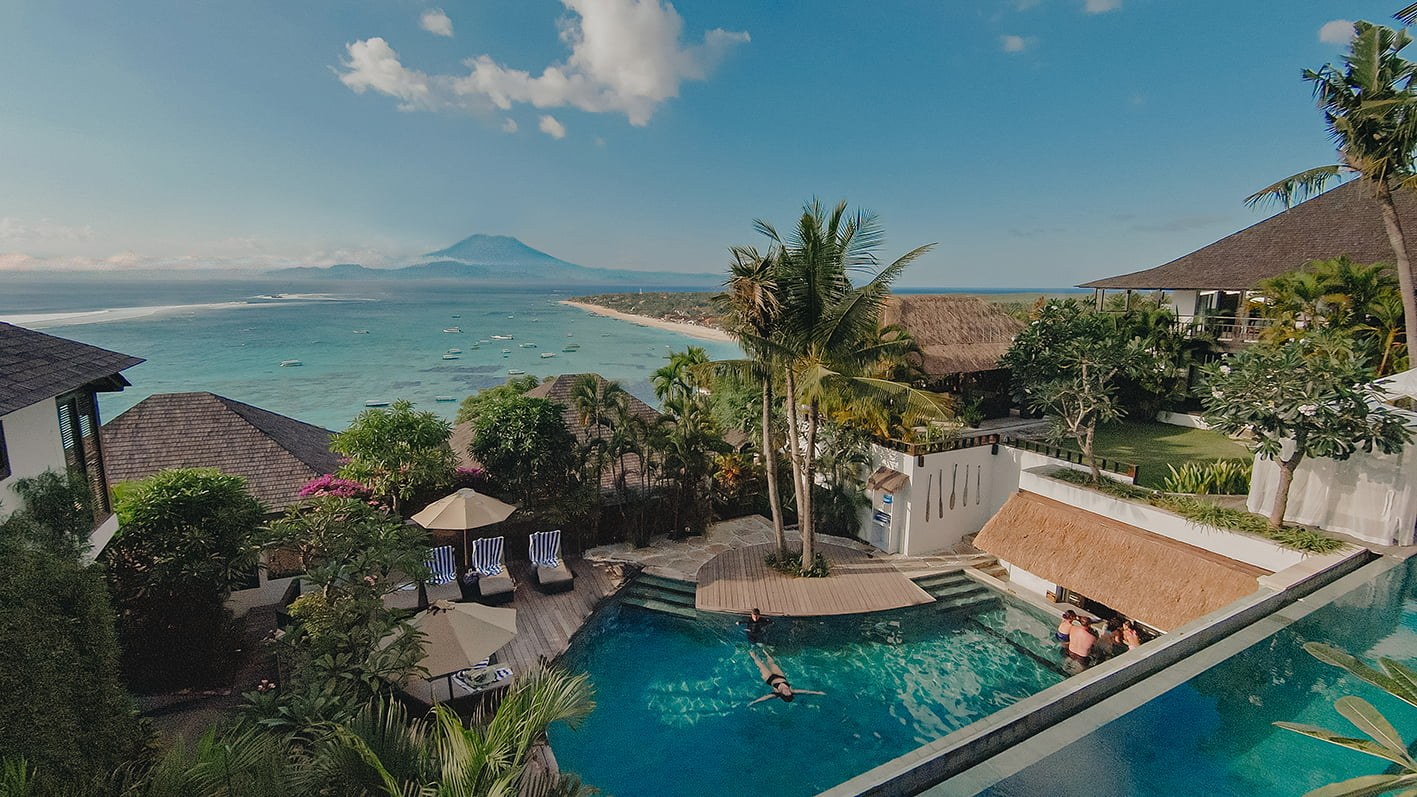 Pools and tropical gardens above the bay at Batu Karang Lembongan Resort & Spa on Nusa Lembongan, Bali