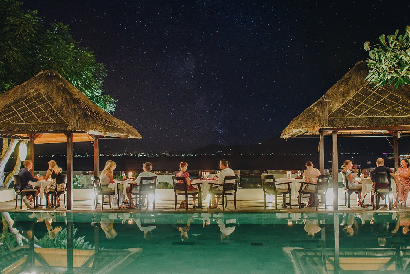 Evening dinner beside the infinity pool under the stars at Batu Karang Lembongan Resort & Spa, Nusa Lembongan, Bali