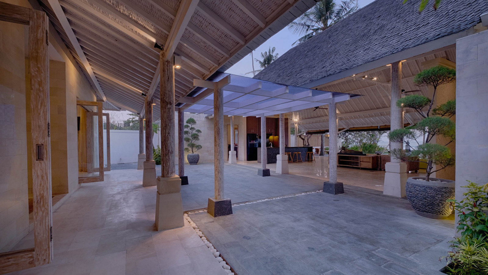 Covered open-air dining and living pavilion at Biara Villa with kitchen area and ocean views