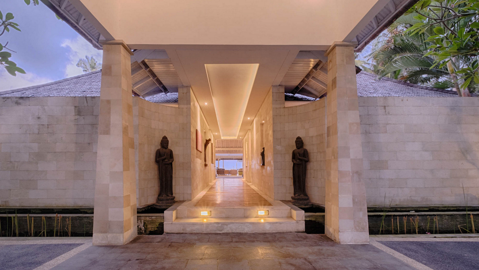 Stone entryway and corridor at Biara Villa, showing traditional Balinese architecture