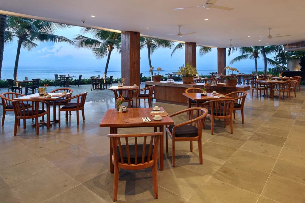 Ocean Terrace Restaurant at Candi Beach Resort, beachfront dining venue with wooden furnishings and sea view