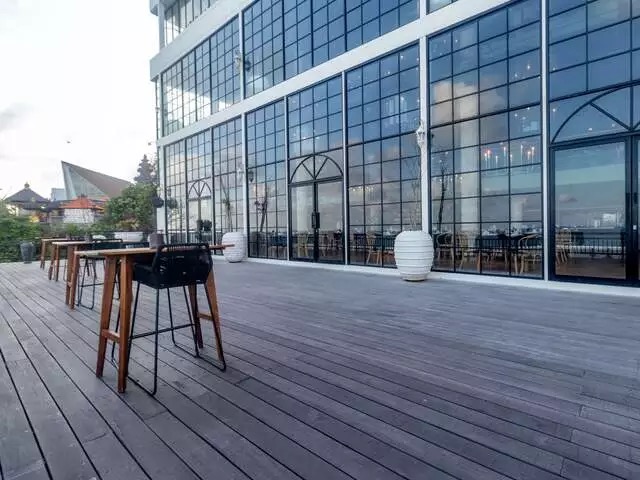 Open wooden deck event space at Canna Bali, Benoa