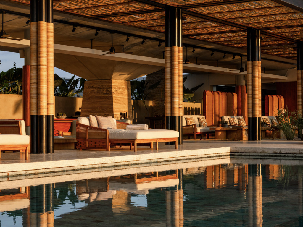 Beach club pavilion and pool in late afternoon light at Cap Karoso on Karoso Beach, Sumba