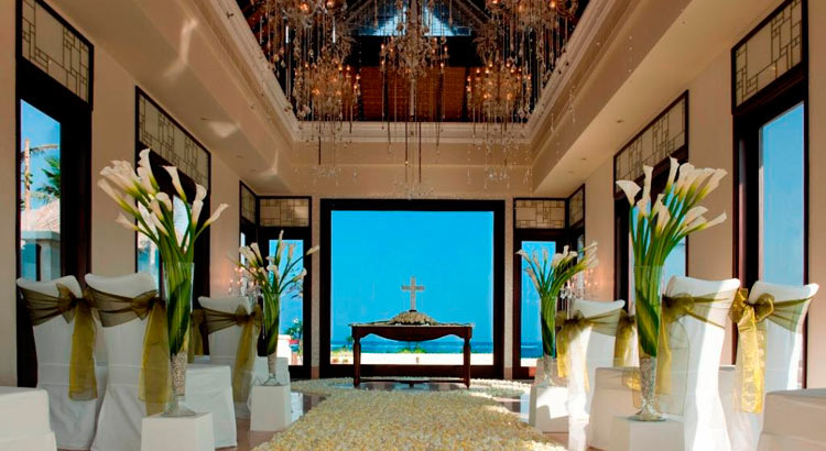 Cloud Nine Chapel interior with crystal chandelier and ocean view, styled with gold and green sashes, The St. Regis Bali Resort, Nusa Dua