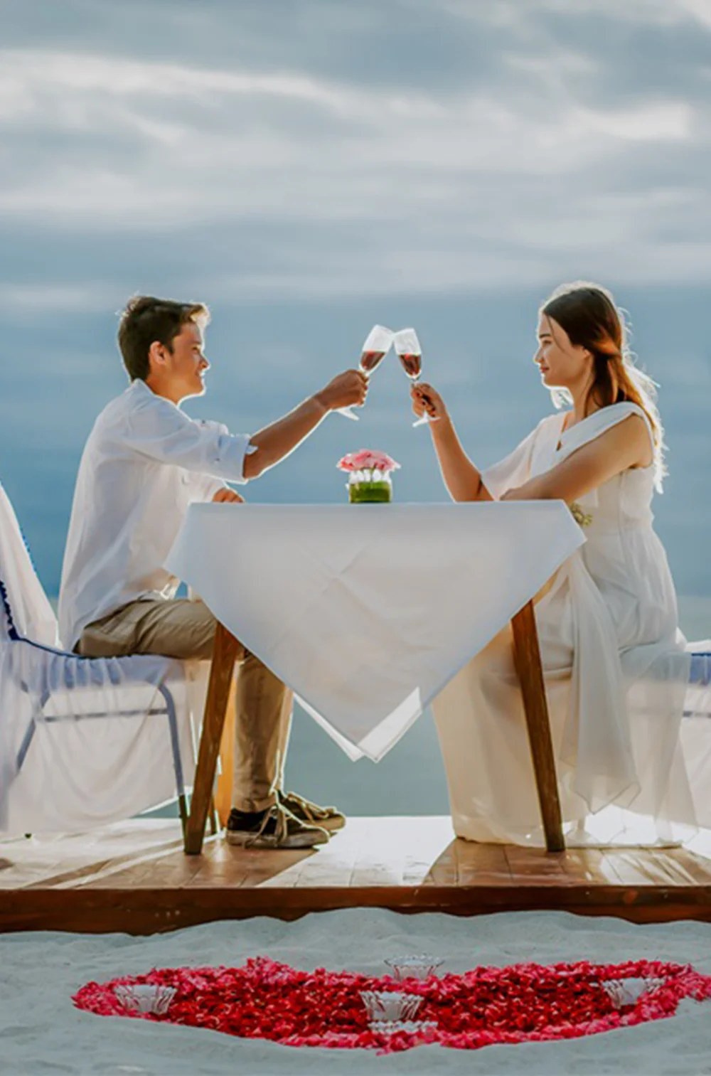 Private dinner for two on the sand with a rose petal heart at d'Nusa Beach Club and Resort, Nusa Lembongan, Bali