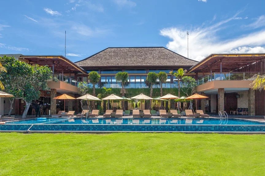 Lawn, pool and resort buildings seen from the beach at d'Nusa Beach Club and Resort, Jungut Batu, Nusa Lembongan, Bali