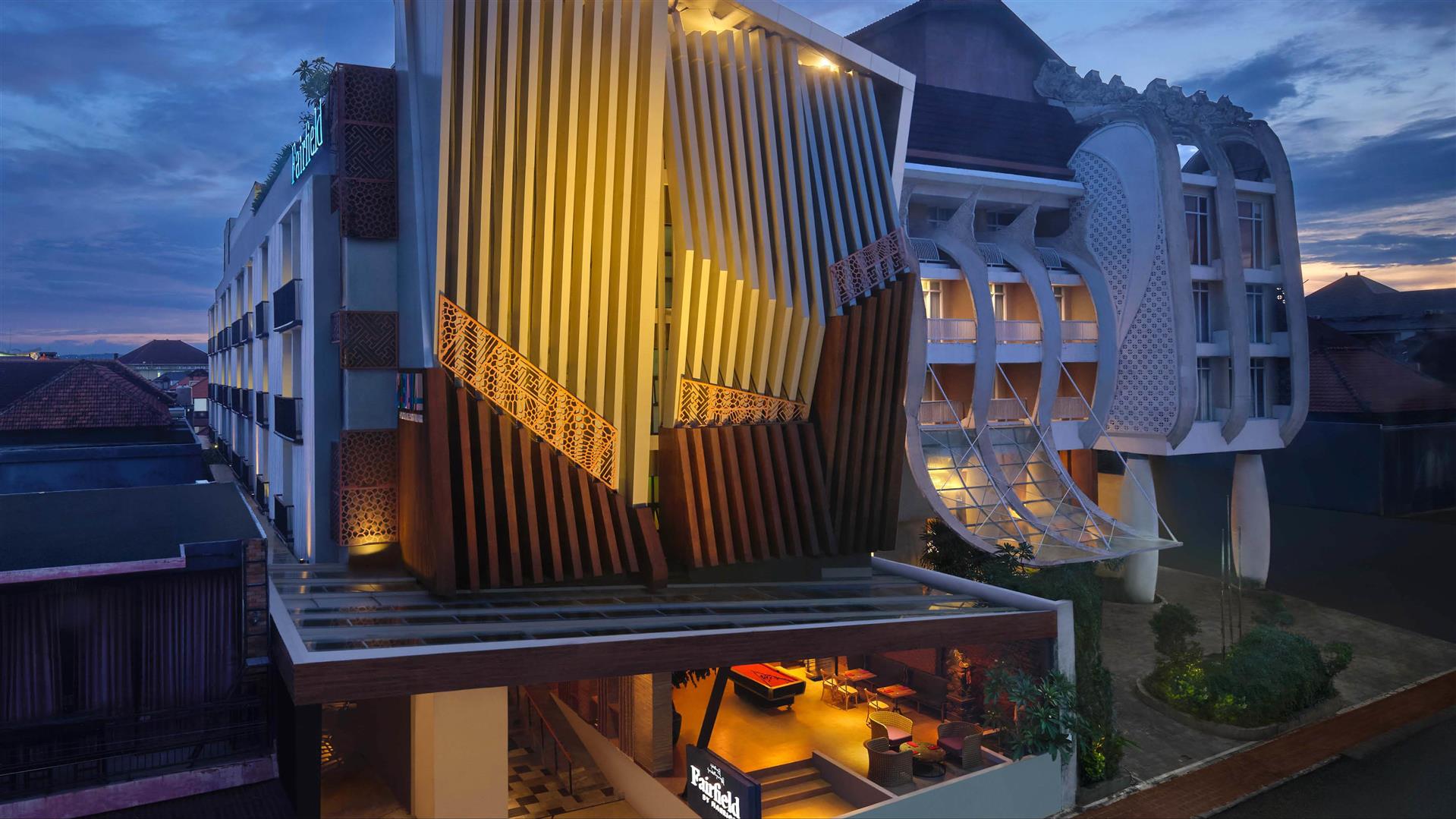 Fairfield by Marriott Bali South Kuta building facade lit at dusk