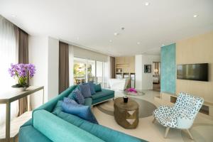 Resort pool area and tropical gardens at Grand Mirage Bali