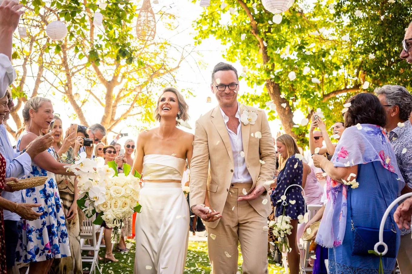 Recessional through cheering guests under lanterns at Hai Tide Beach Resort, Nusa Lembongan, Bali