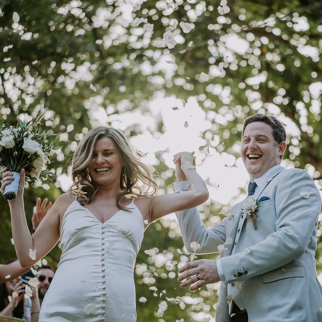 Confetti exit under the trees after a beach ceremony at Hai Tide Beach Resort, Nusa Lembongan, Bali