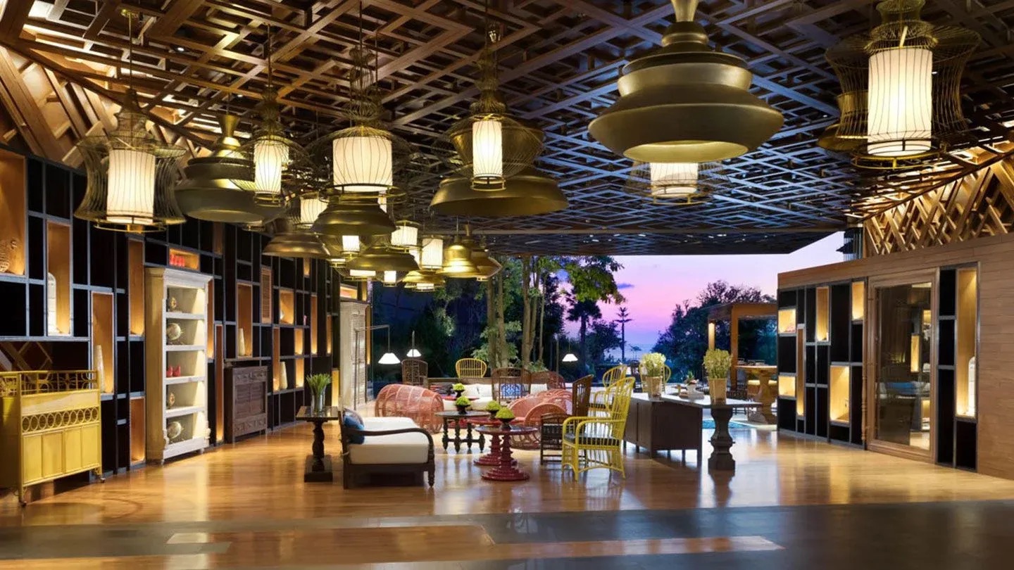 Reception lounge with sunset view overlooking the beach and tropical gardens at Hotel Indigo Bali Seminyak