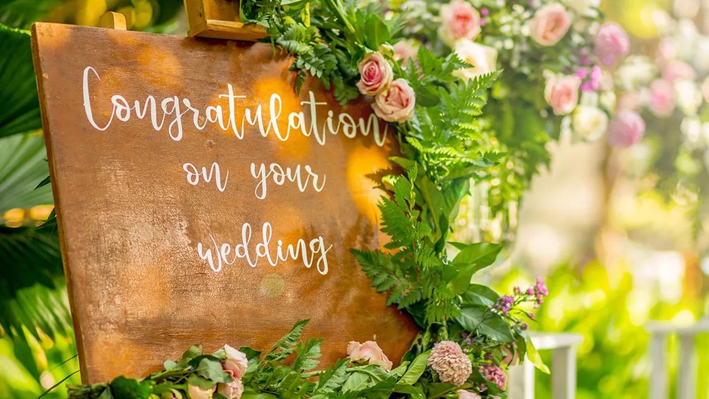 Congratulations sign with floral garland at wedding ceremony at Hotel Indigo Bali Seminyak Beach