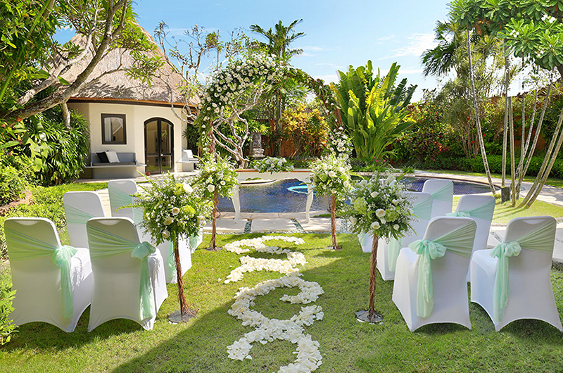 Private pool and garden at a villa in Impiana Private Villas Seminyak