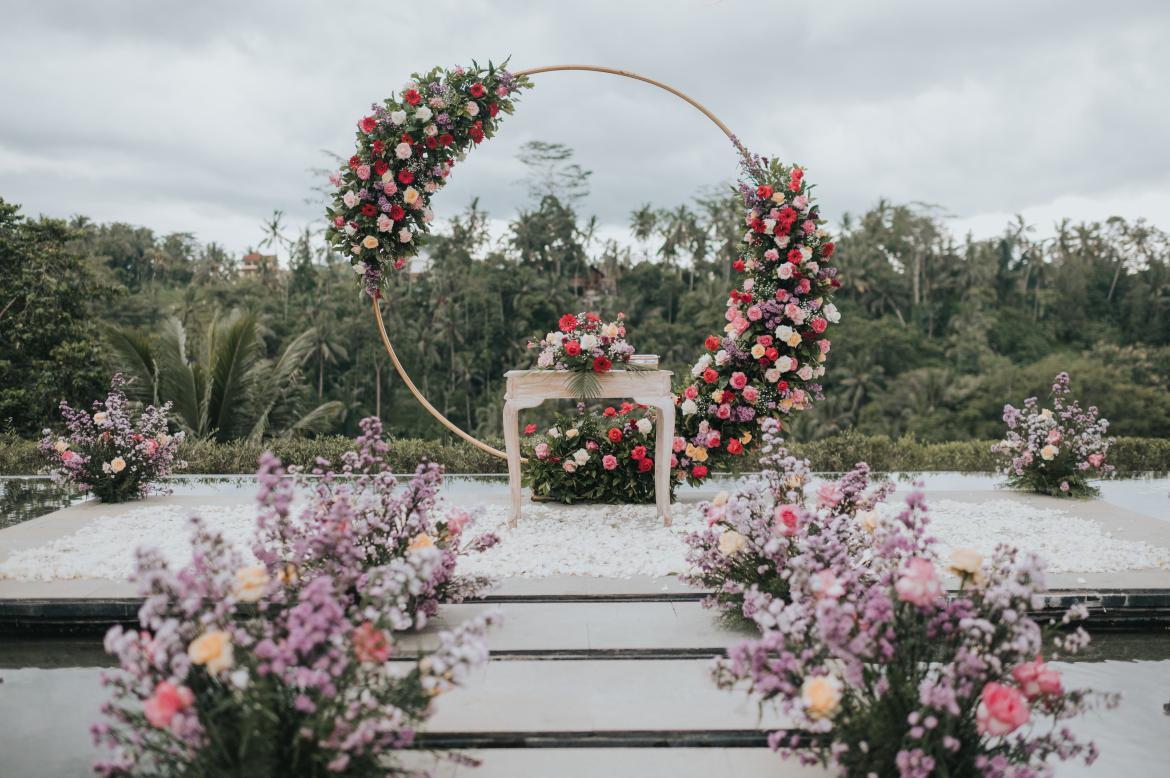 Infinity-pool ceremony deck overlooking jungle river valley at Jannata Resort, Ubud