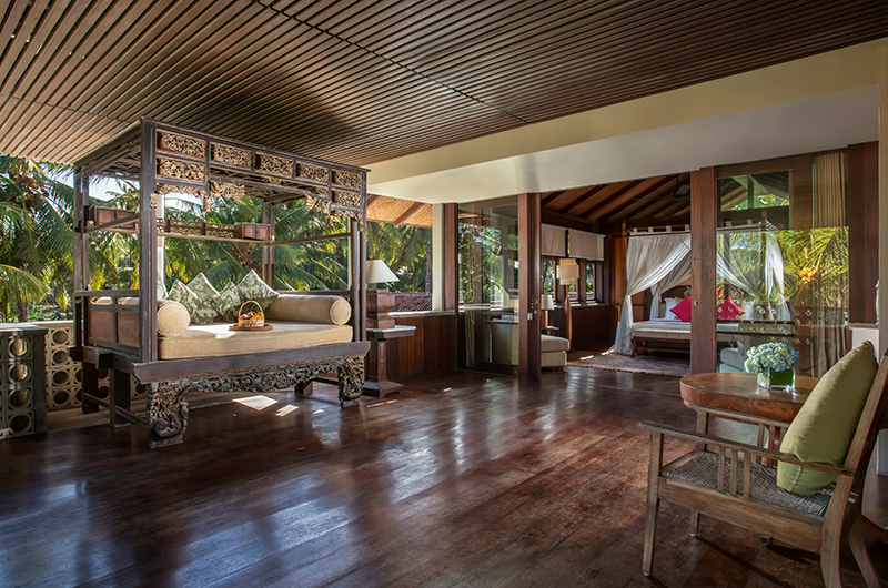 Open bedroom pavilion at Jeeva Saba with a four-poster bed and garden views