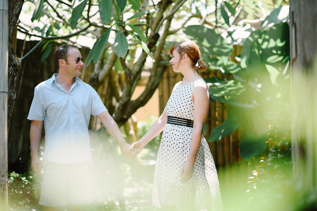 Couple in the lush forest gardens at Kamandalu, overlooking the Petanu River valley, Ubud