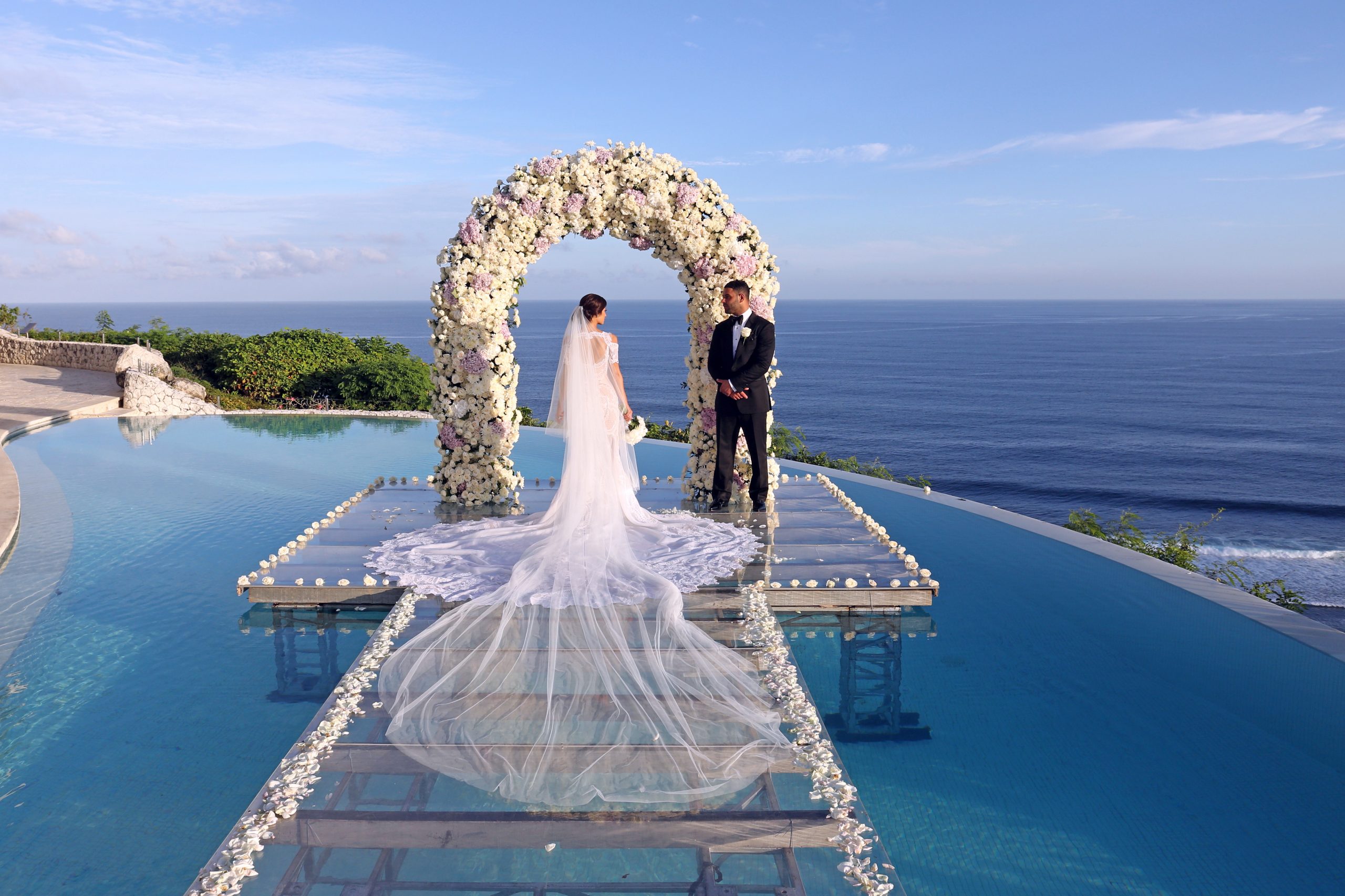 Poolside ceremony setting at Karma Kandara above the Indian Ocean, Ungasan