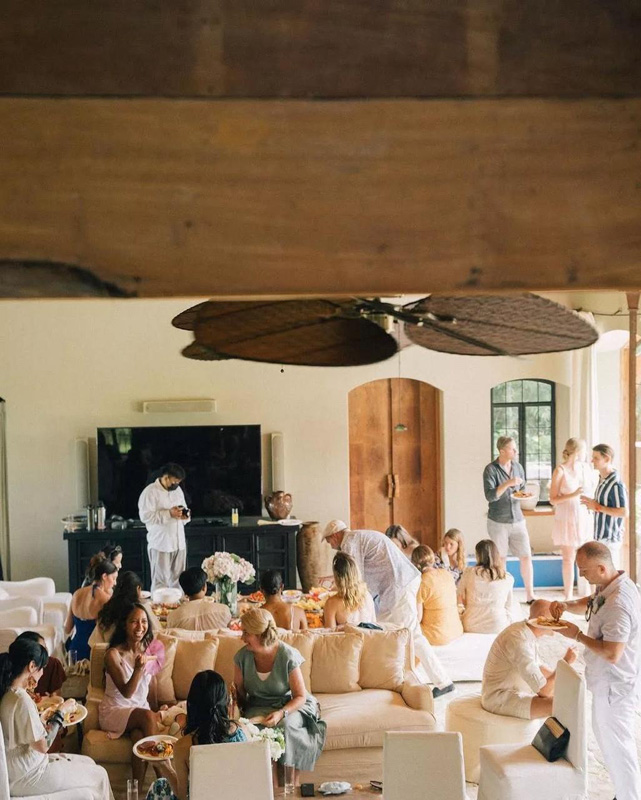 Guests gathered in the open living pavilion with French windows and arched doors at The Kemilau Villa Umalas, Canggu