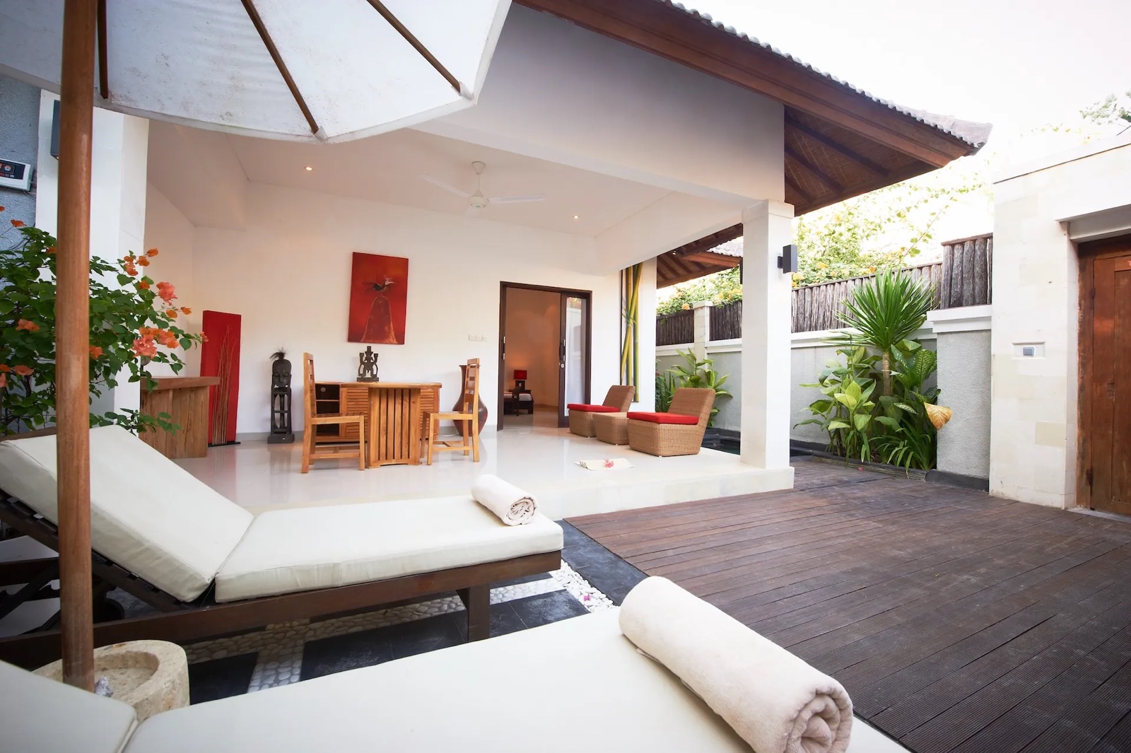 Villa courtyard with pool, day beds and an open living pavilion at Ko-Ko-Mo Gili T Resort, Gili Trawangan