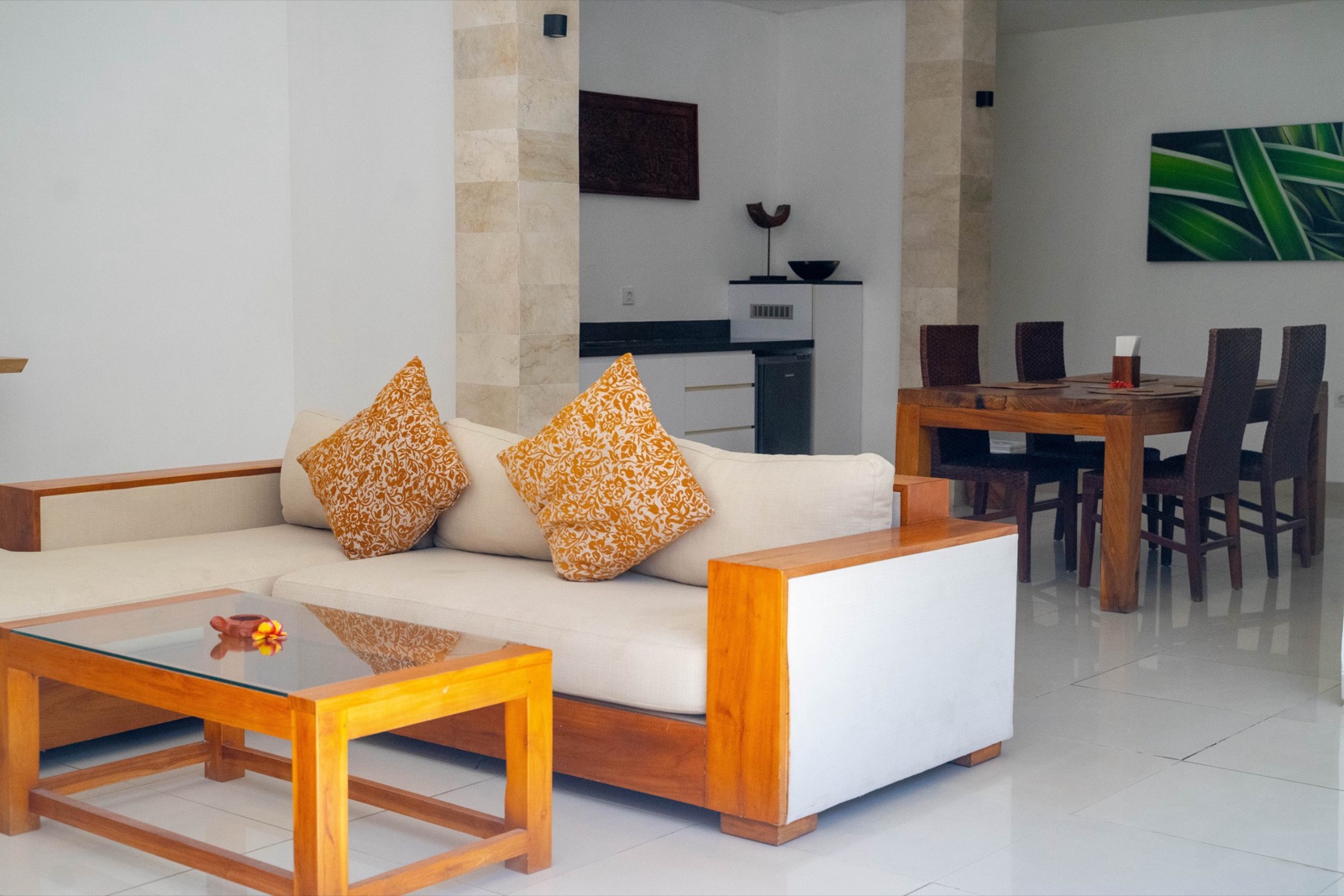 Villa living and dining room with teak furniture at Ko-Ko-Mo Gili T Resort, Gili Trawangan