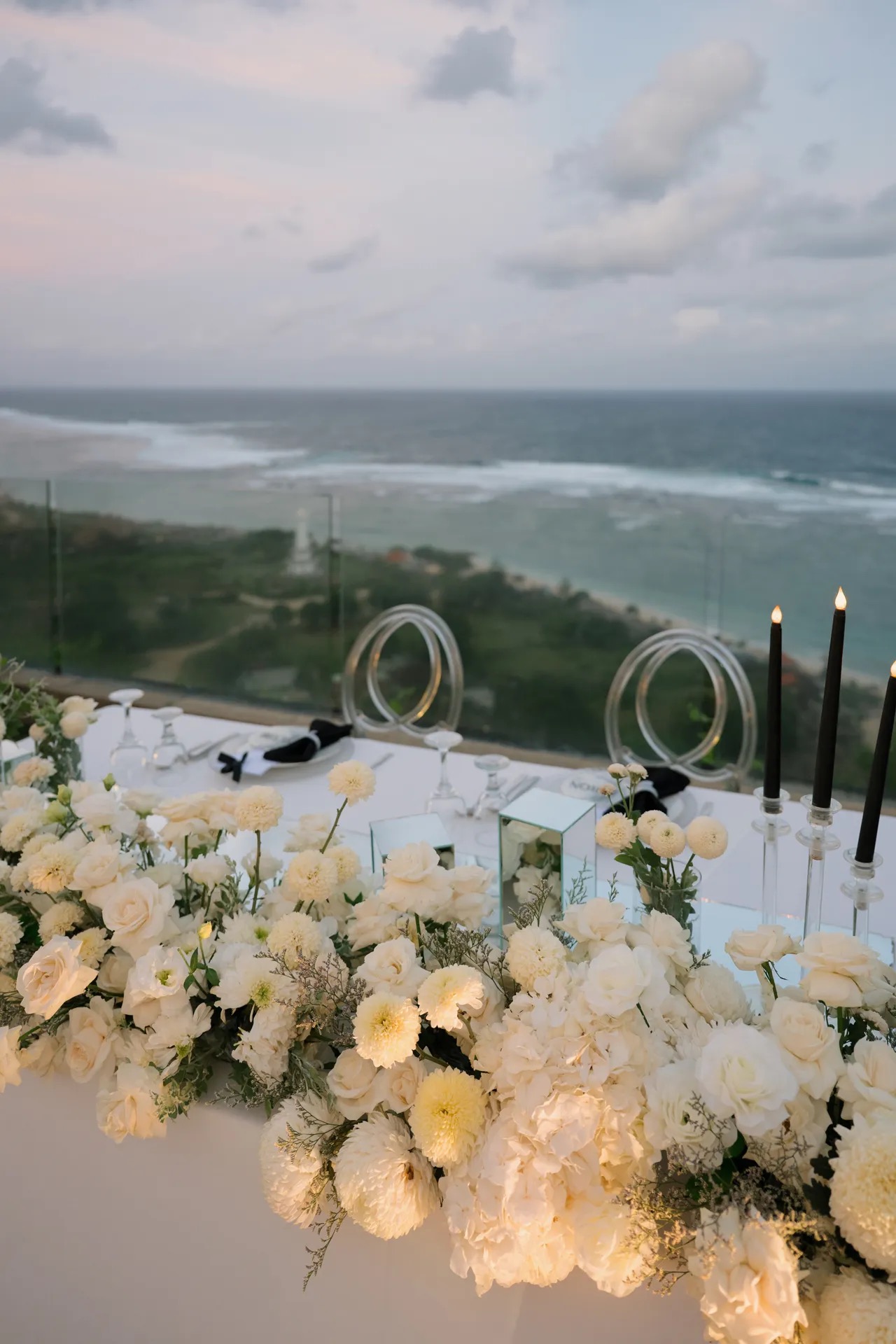 A clifftop wedding ceremony setup at Latitude Villa with an ocean view over Pandawa Beach, Bali