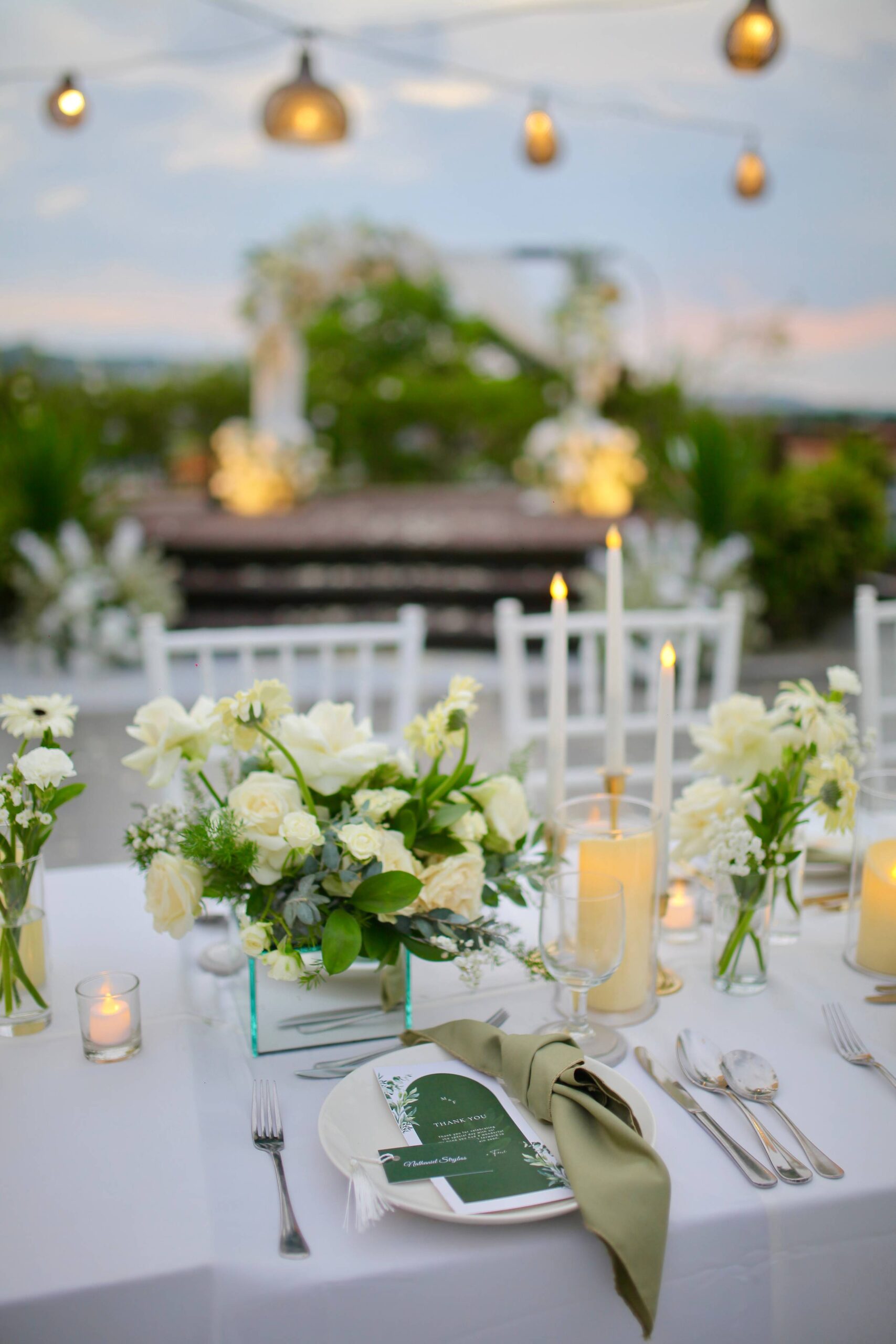 Wedding styling at The Leaf Jimbaran, tropical greenery and florals framing the setting