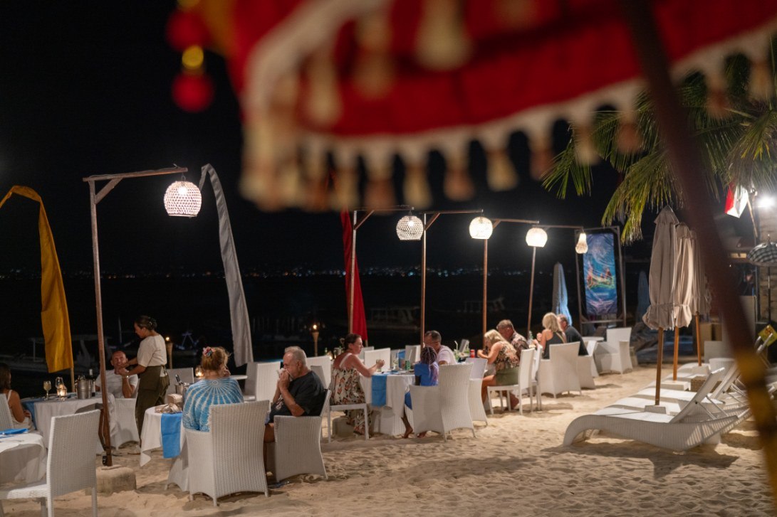 Evening dining under hanging lanterns at Lembongan Beach Club & Resort on Nusa Lembongan, Bali