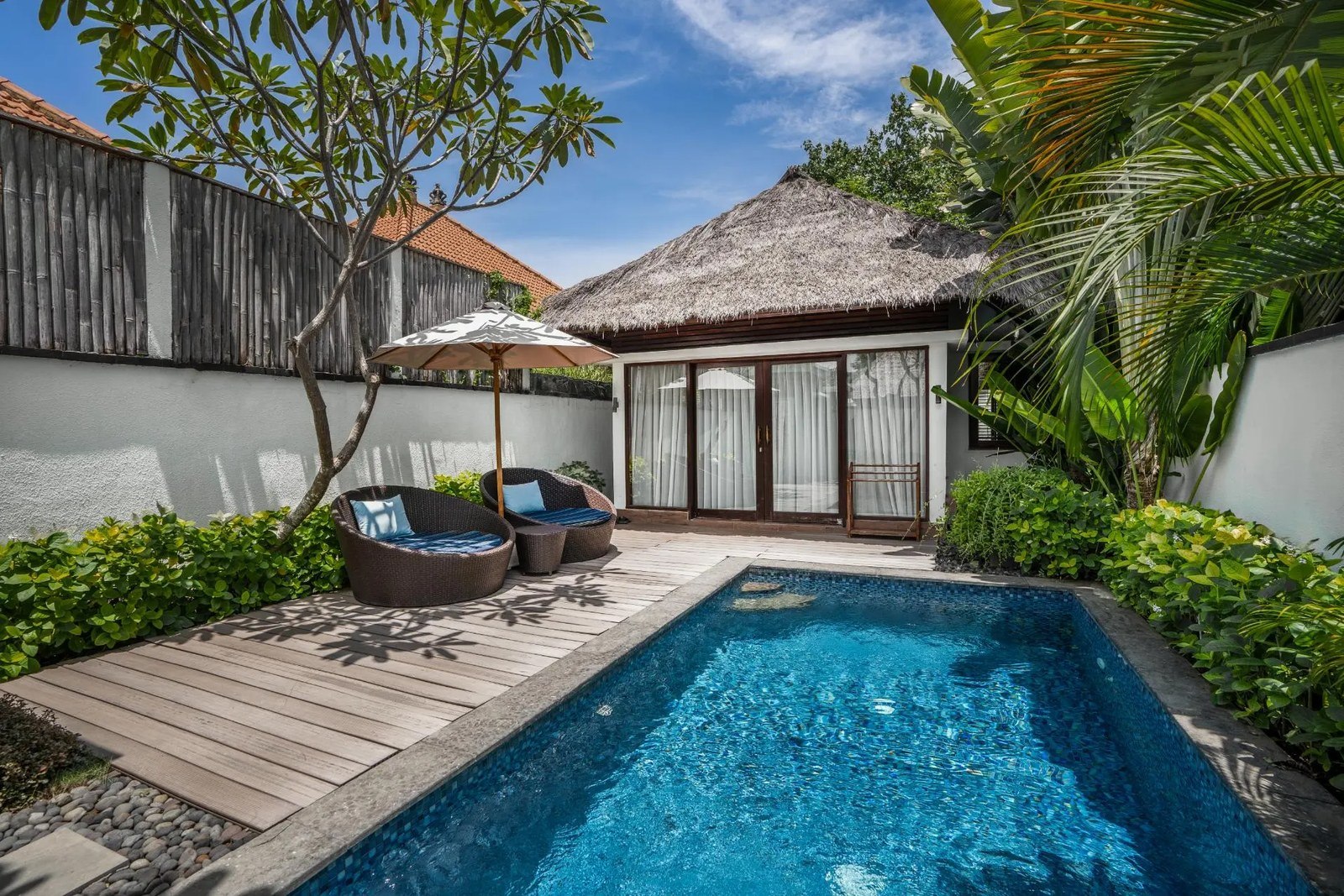 Private pool villa with a timber deck and tropical planting at Lembongan Beach Club & Resort, Nusa Lembongan, Bali