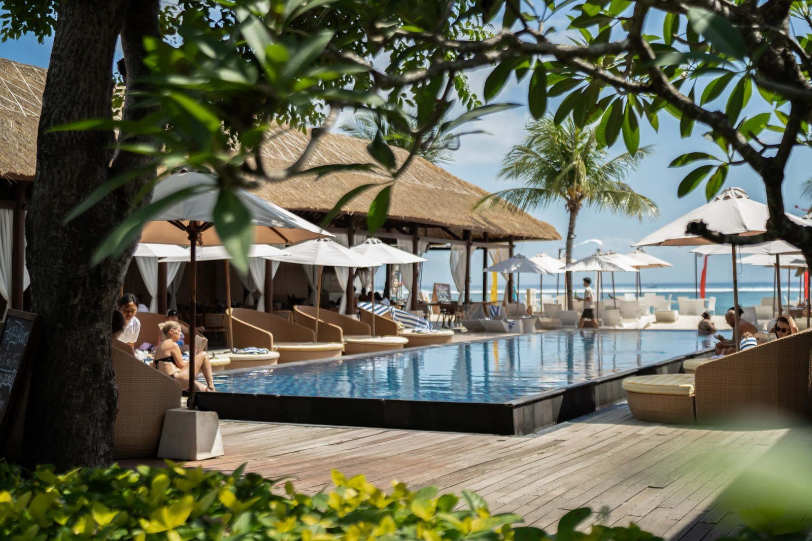 Beachfront infinity pool with loungers looking out to the ocean at Lembongan Beach Club & Resort, Nusa Lembongan, Bali