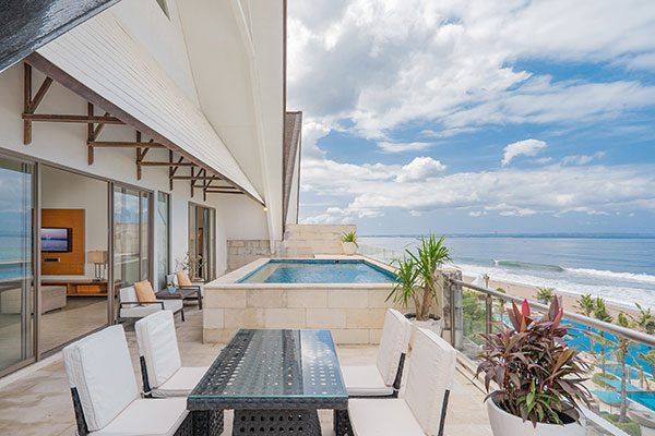 Beachfront resort exterior and pool at Lv8 Resort Hotel on Berawa Beach, Canggu