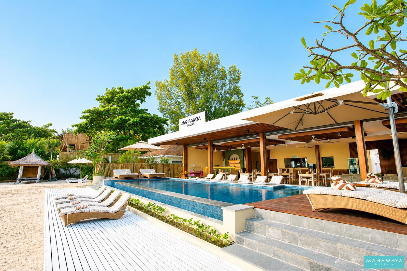 Timber deck, pool and beach bale in front of the restaurant at Mahamaya Gili Meno, Gili Meno