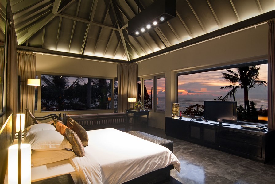 Ocean-view bedroom suite at Mahatma House at sunset