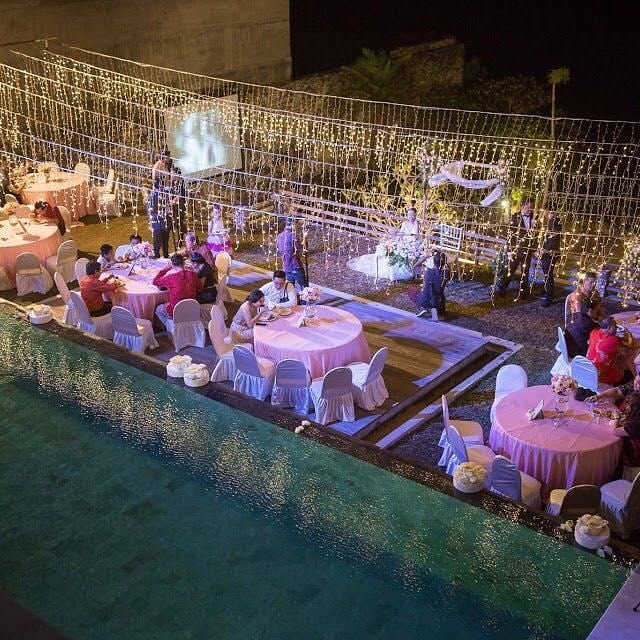 Cliff-top dinner setting with ocean view at Maiara Villa