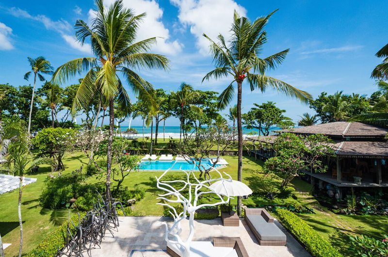 Beachfront lawns and gardens at Morabito Art Villa on Berawa Beach, Canggu, facing the Indian Ocean