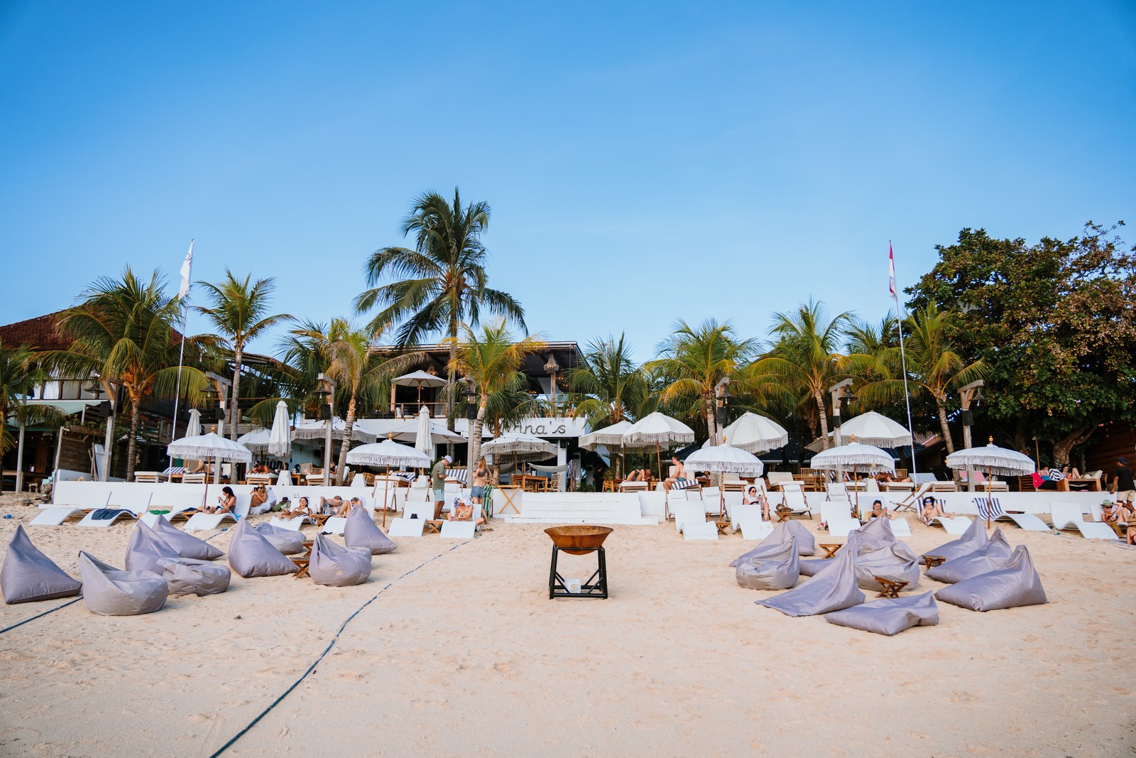 Beanbags and umbrellas on the sand at the beach club at Ohana's, Jungut Batu, Nusa Lembongan, Bali