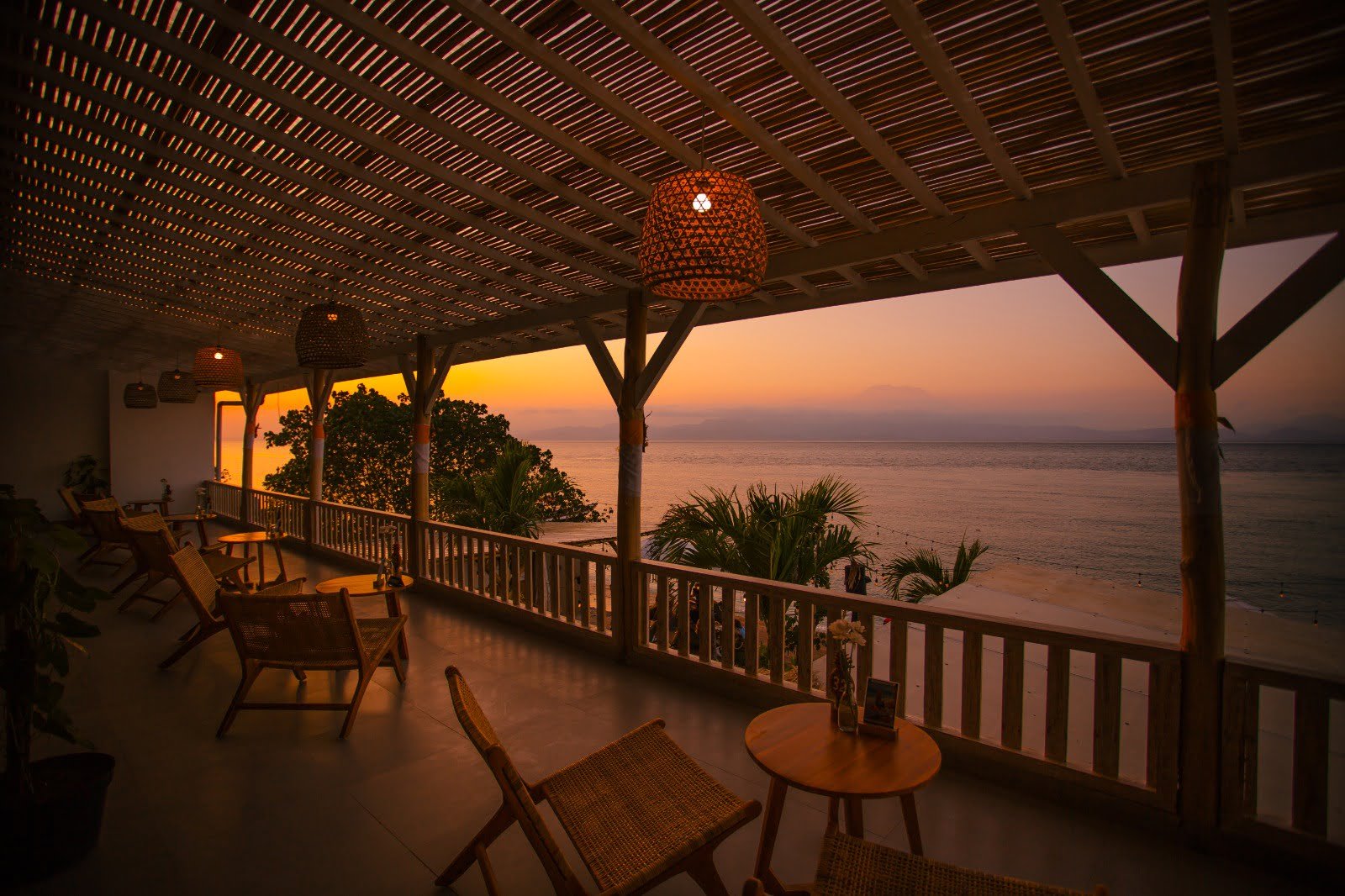 Upstairs terrace at sunset looking across the strait to Mount Agung at Penida Colada on Nusa Penida, Bali