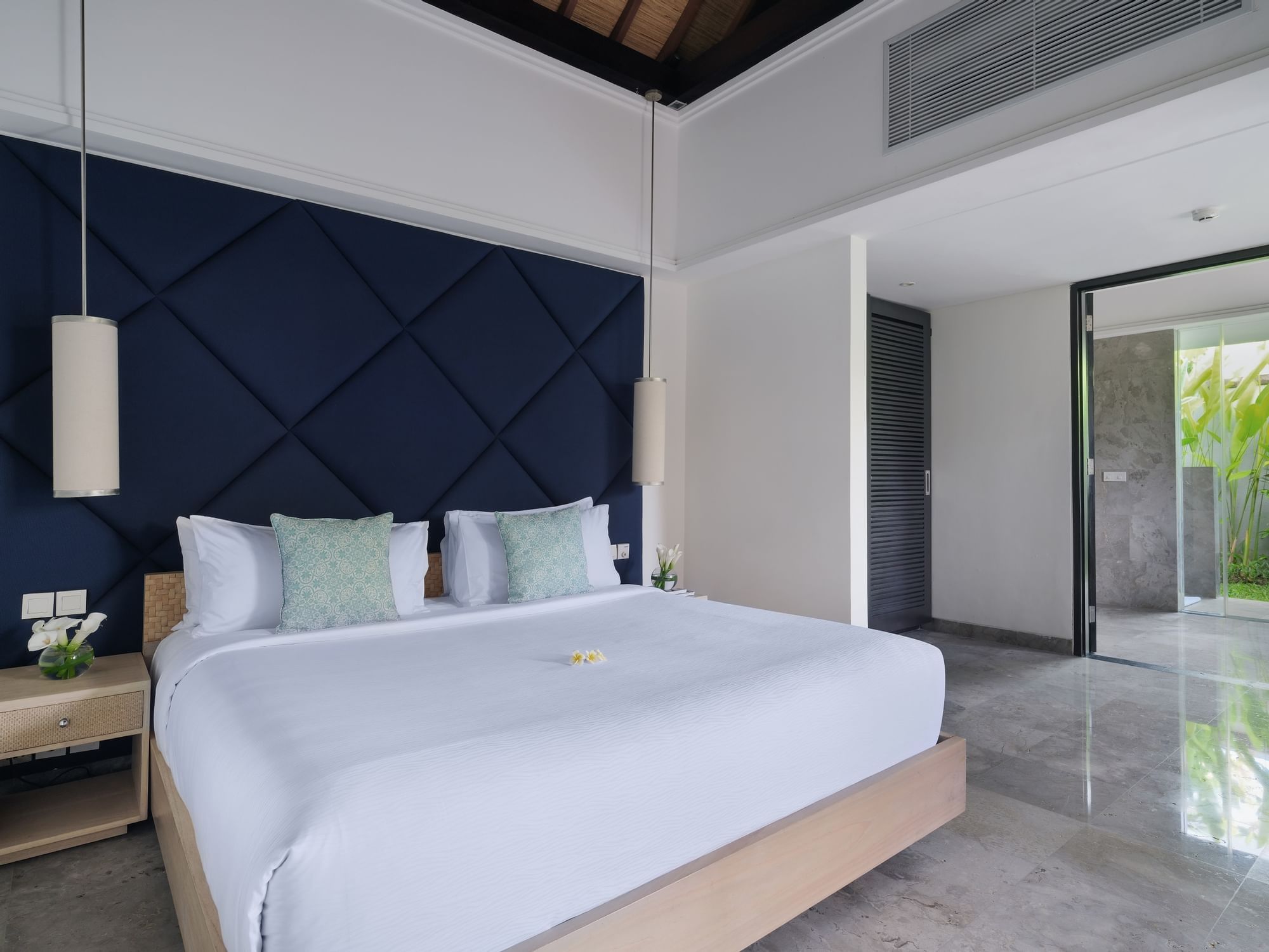 One-bedroom pool villa interior opening to a private pool at Peppers Seminyak