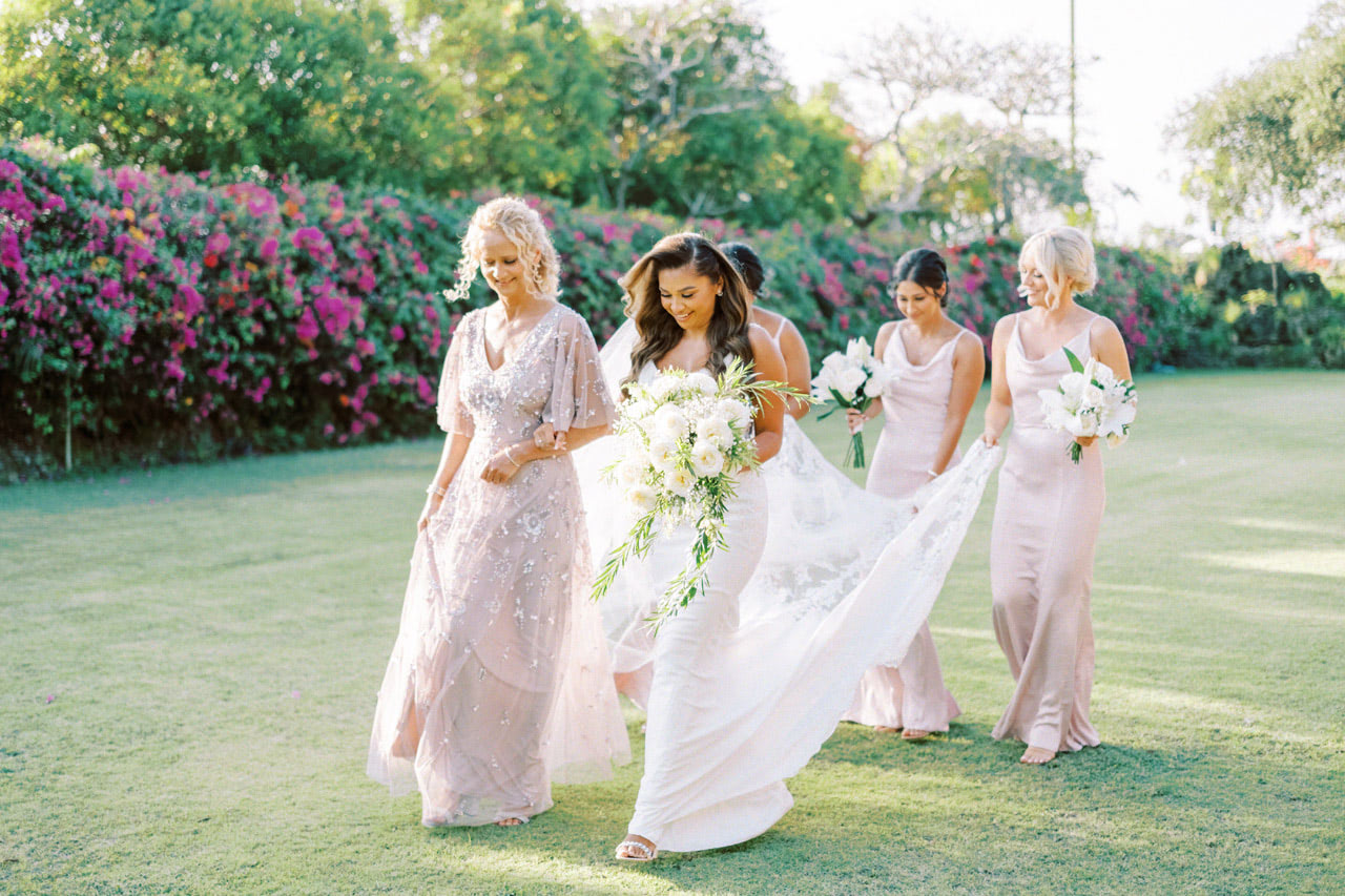 Bridal party portrait on the clifftop gardens at Puri Bhagawan