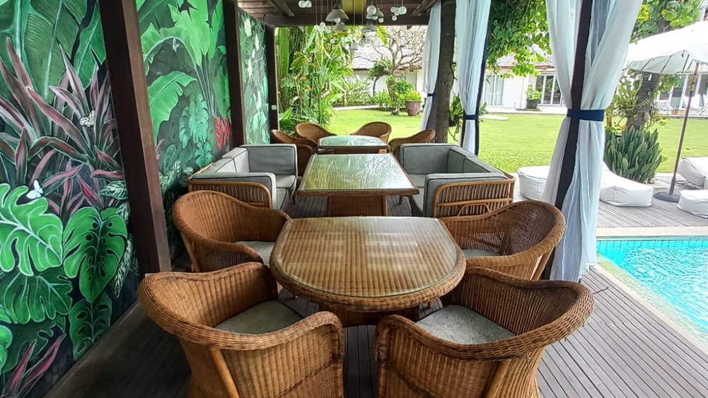 Outdoor dining set on the garden terrace at Villa Puri Nirwana