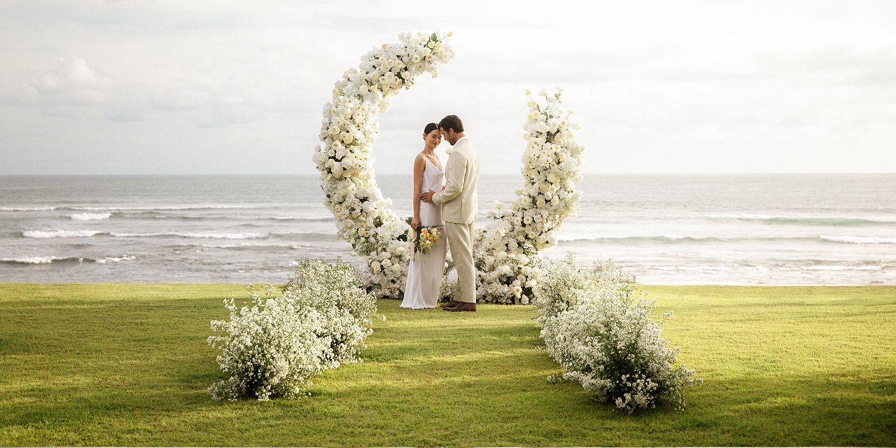 Beachfront wedding setting at Regent Bali Canggu, with the resort lawn opening onto Batu Bolong beach and the Indian Ocean